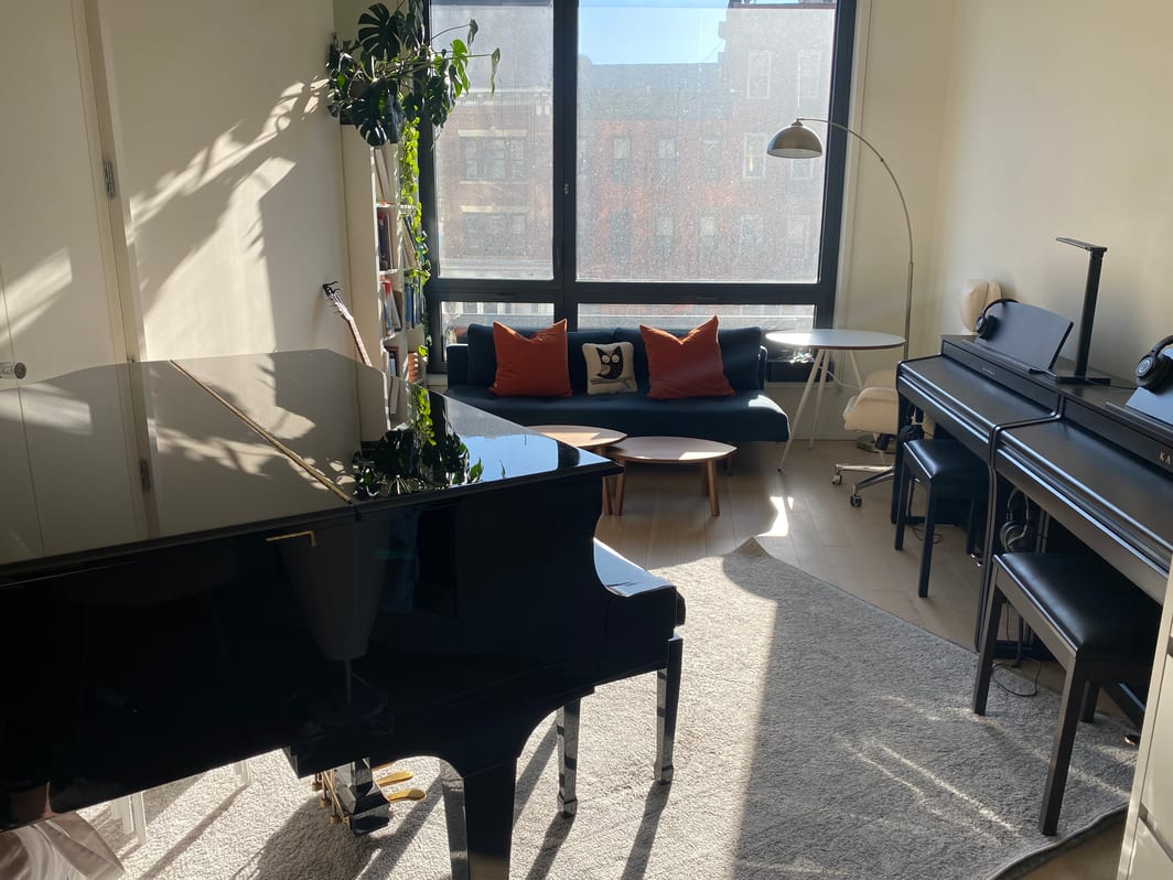 my studio with grand piano and two high-end keyboards