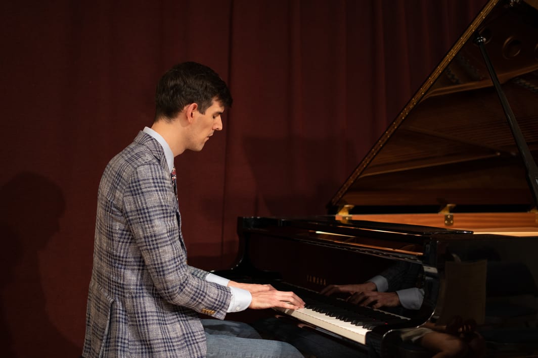 student at piano